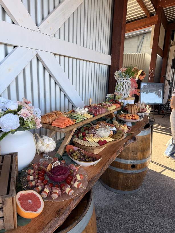 Long rustic grazing boards beside barn doors
