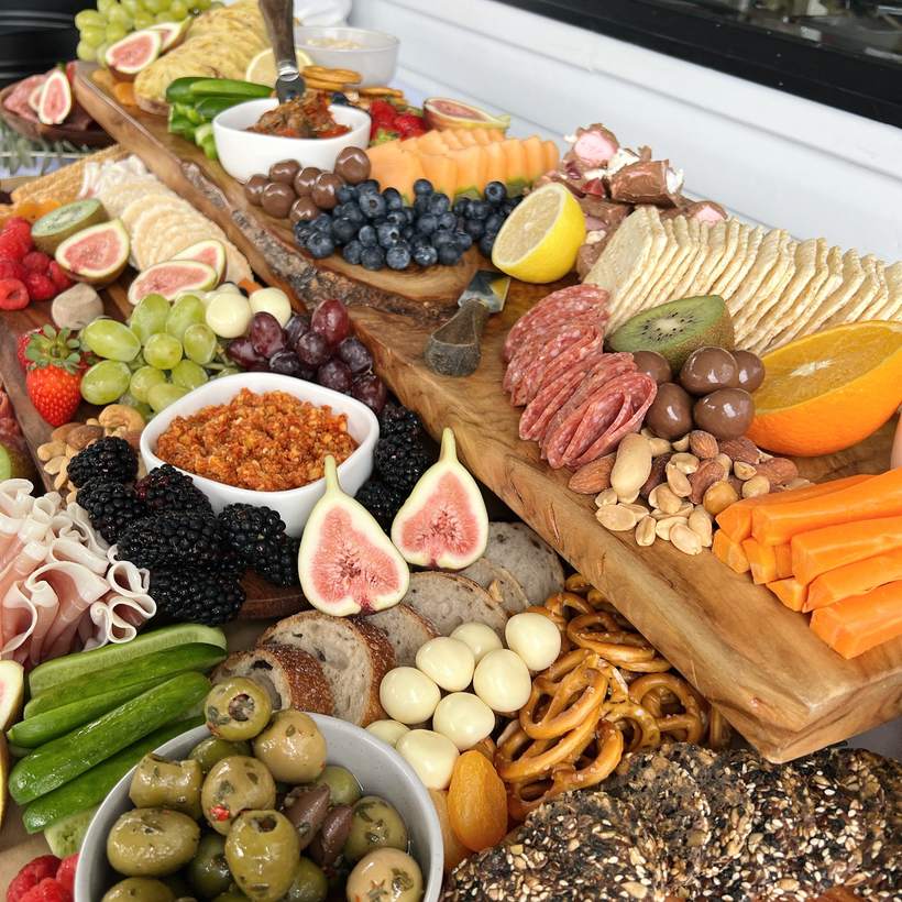 Close-up of figs, olives, fresh fruit and dips