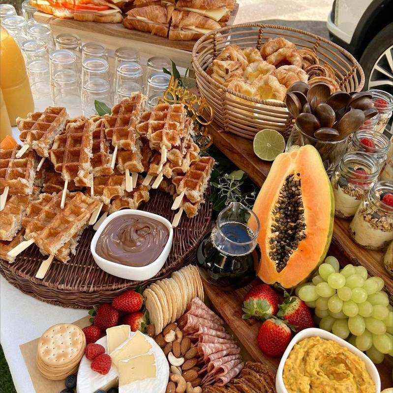 Brunch grazing with waffles, papaya, grapes and dips